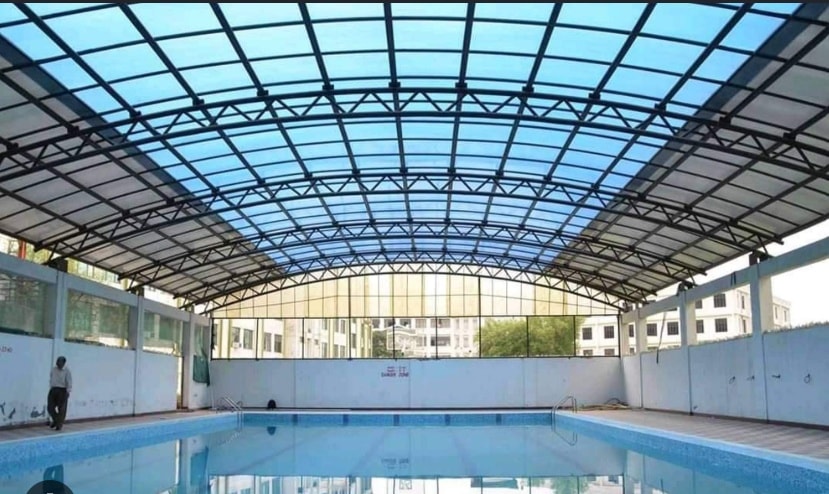 Swimming pool shade canopy